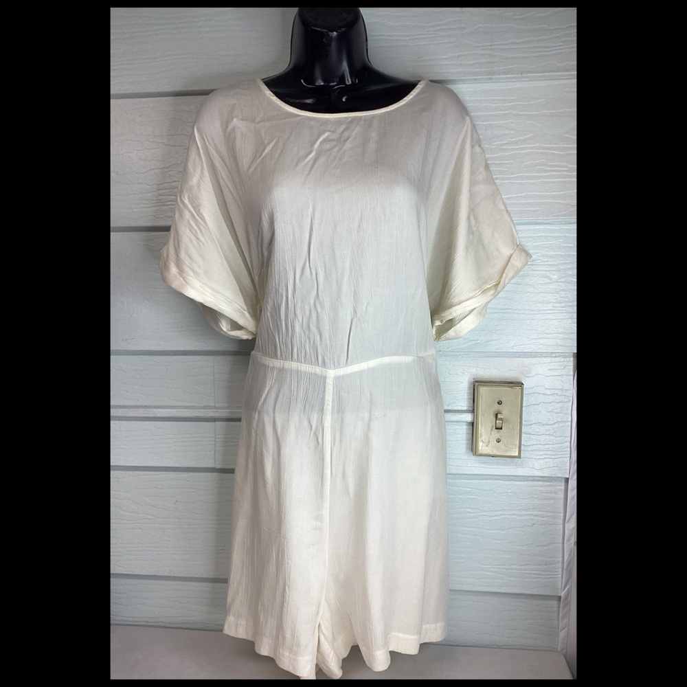 Elegant Cream Romper. 31